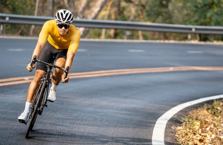 cyclist in yellow on a road