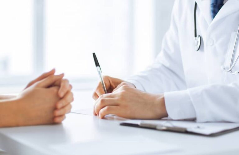 Doctor and patient talking at a table