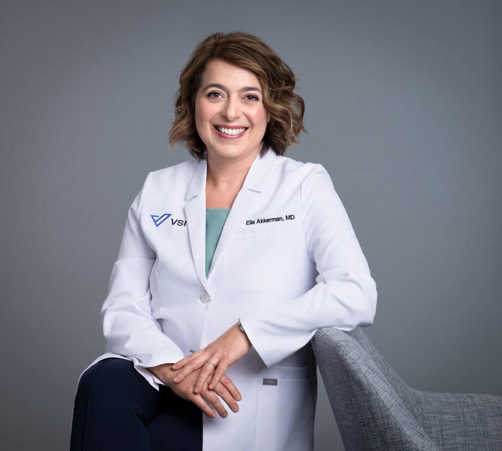 female doctor leaning on a chair
