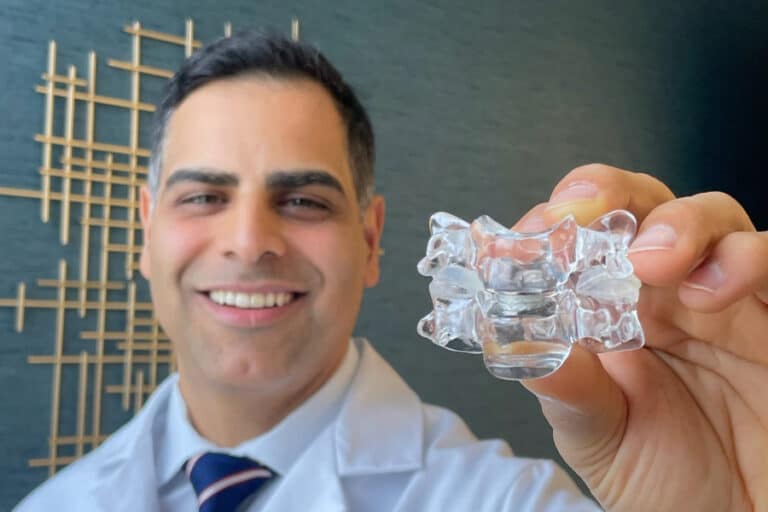 dr. jazini holding artificial disc