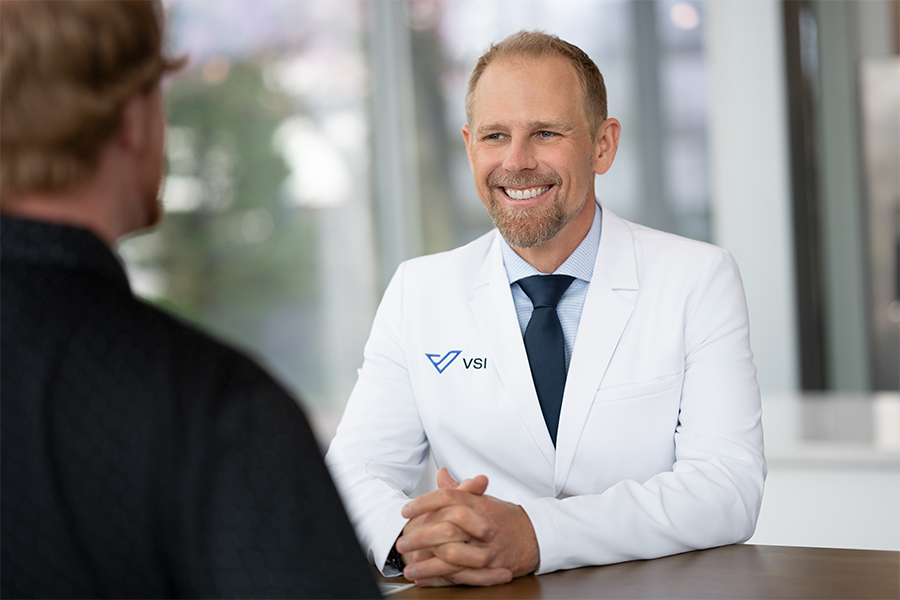 Doctor listening and talking to a patient