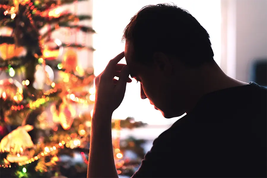 man with headache on christmas