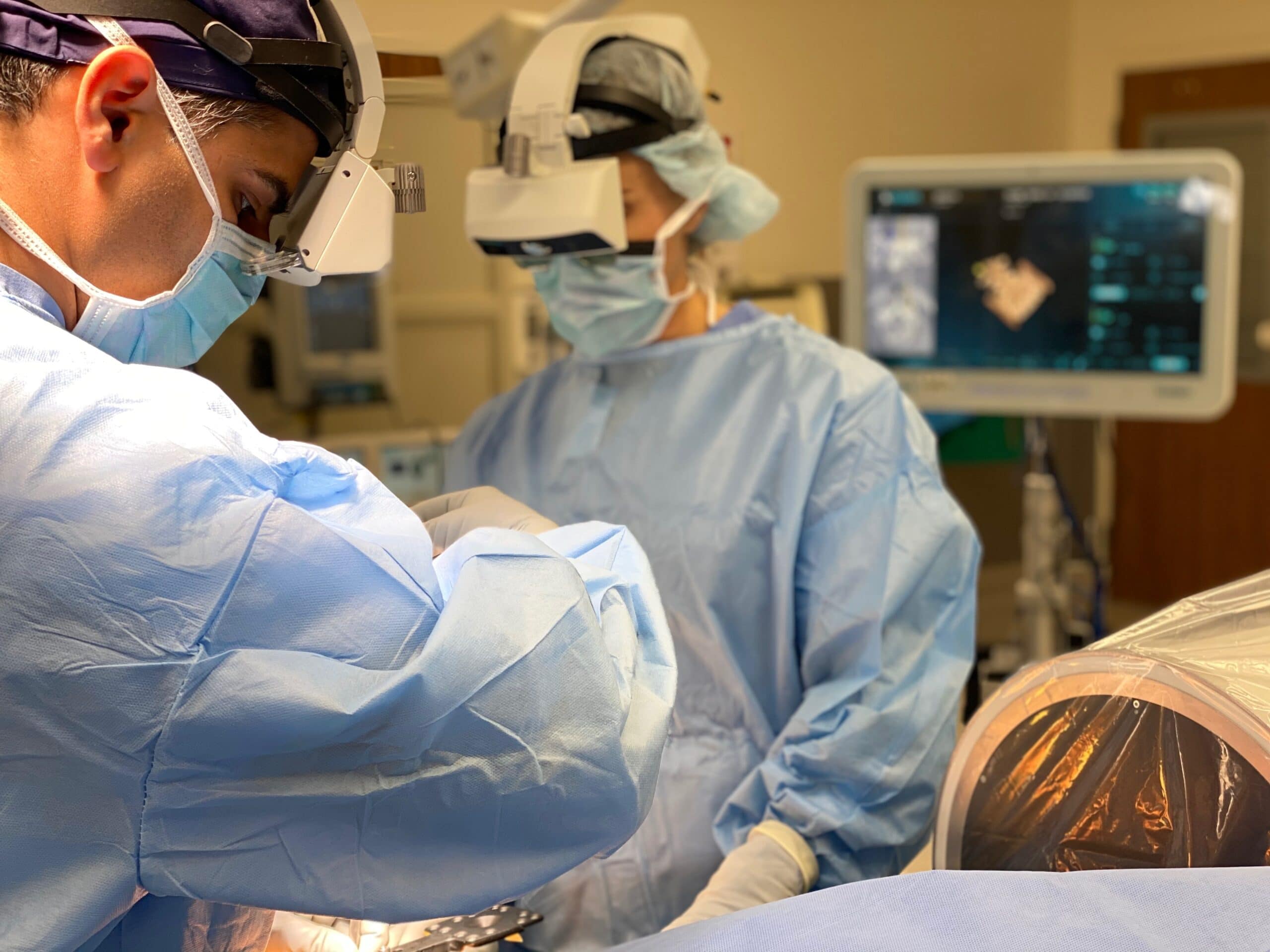 Spine surgeon performing surgery