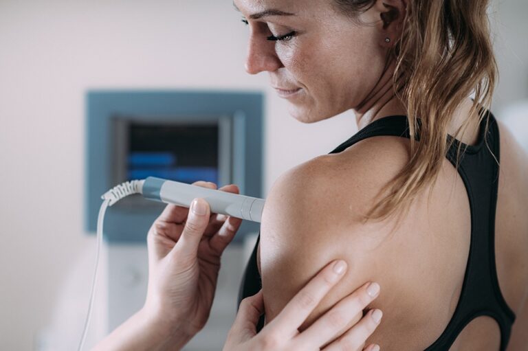 woman getting laser therapy in arm