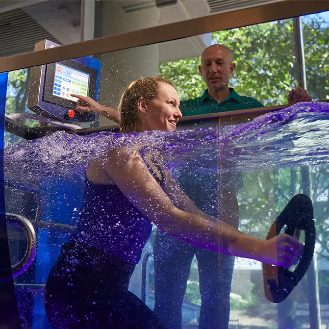 patient using weights in aquatic treadmill