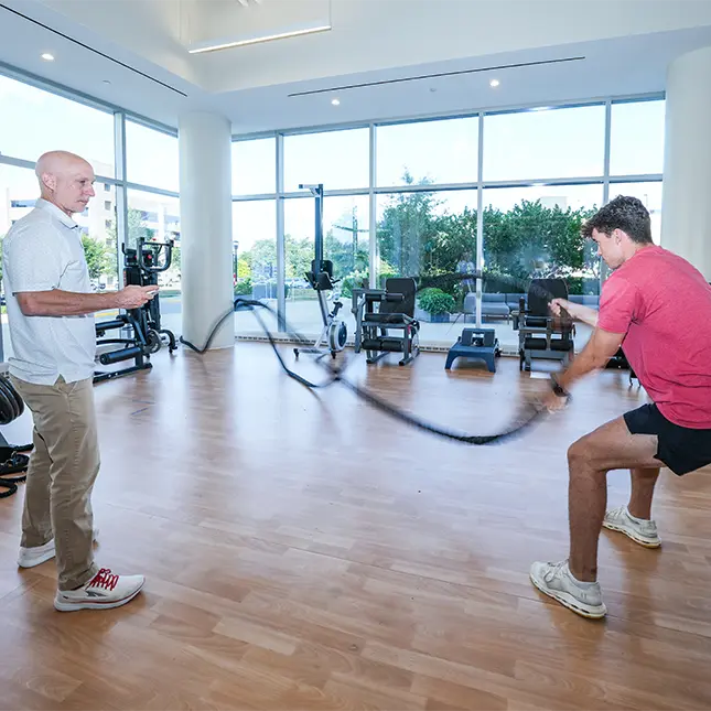 pt helping patient exercise