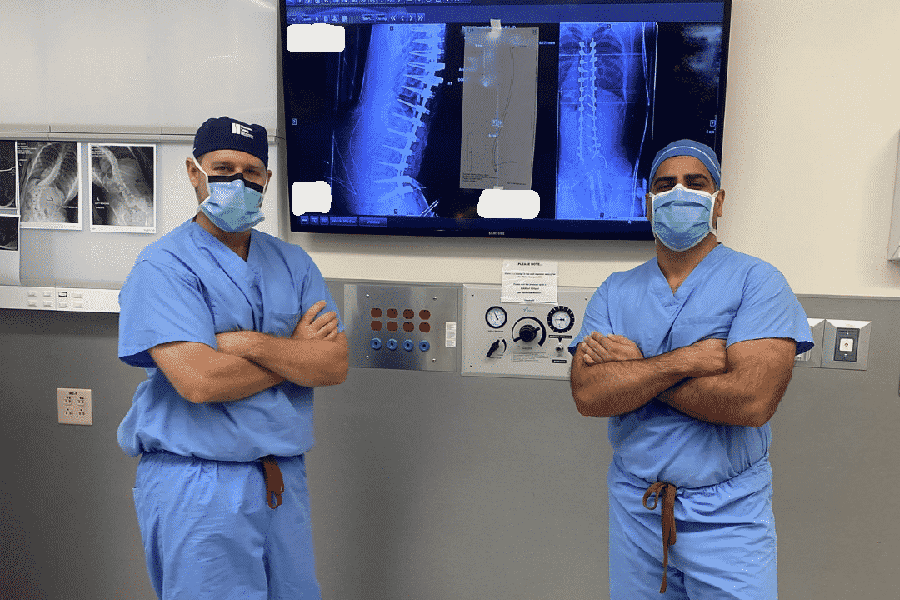 spine surgeons collaborating in operating room