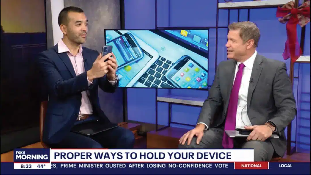 Dr. Haines on Fox5 DC news holding his cell phone in ergonomic position