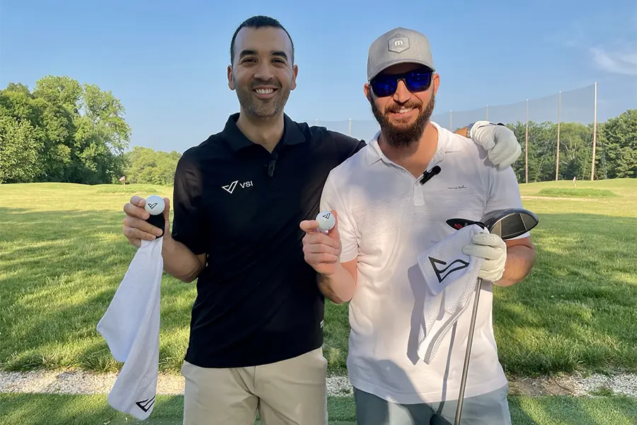 two men posing while playing golf