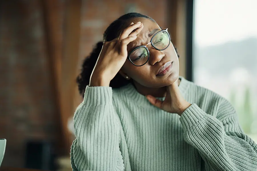 young black woman having stress and pain